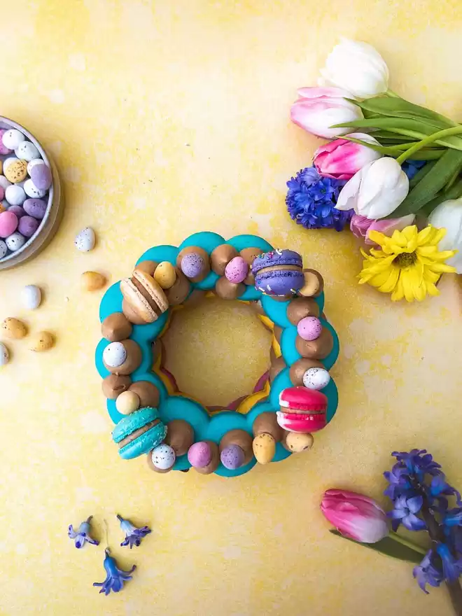 colourful DIY macaron stack cake with mini eggs