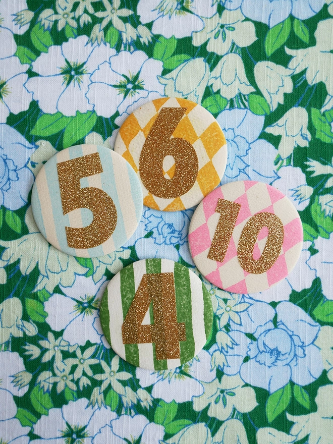 Gold glitter badges in various numbers