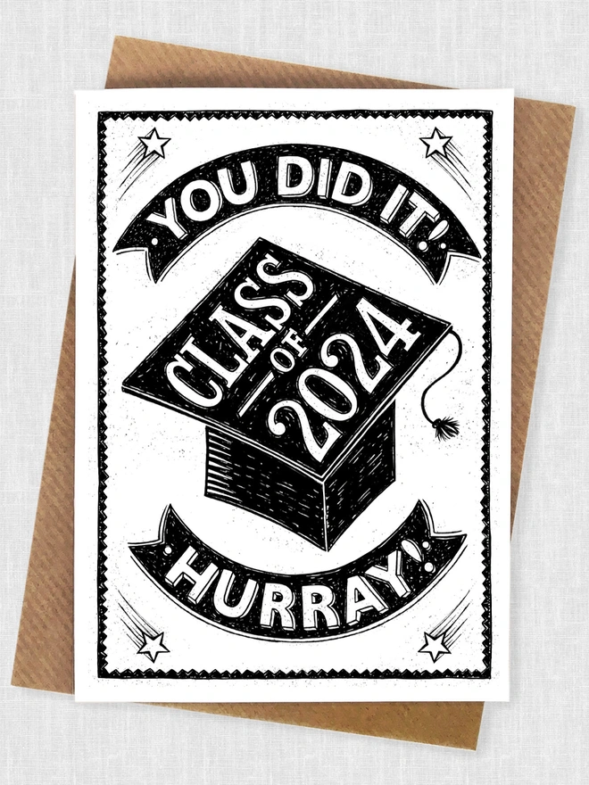 black and white class of 2024 graduation card with brown envelope