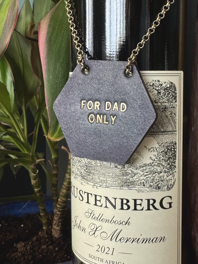 Painted wine bottle leather tag