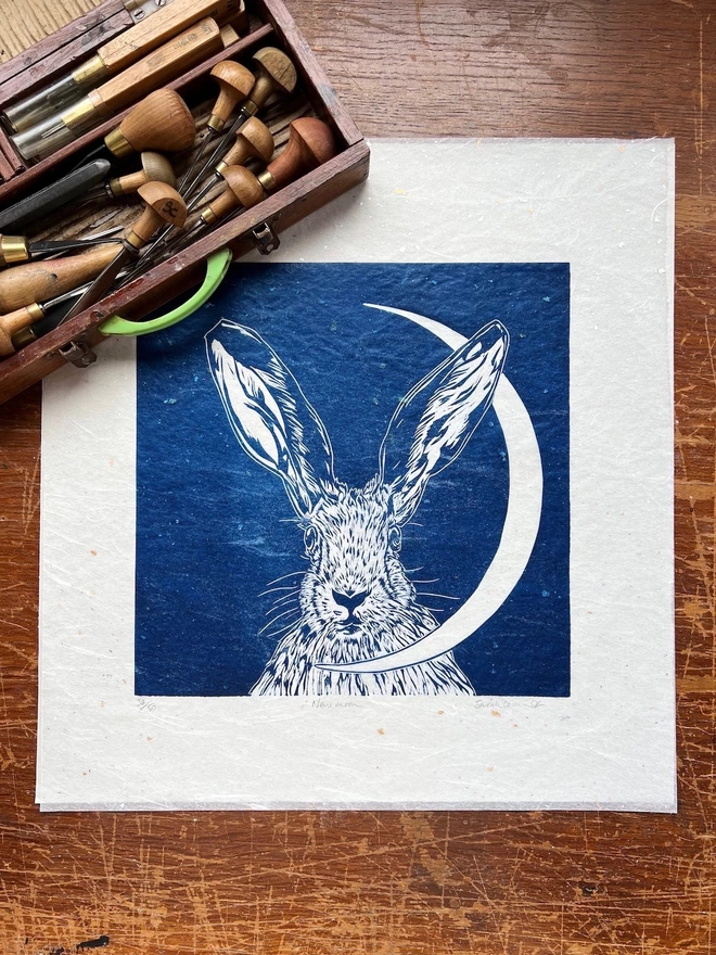 hare head and crescent moon linocut in pure blue
