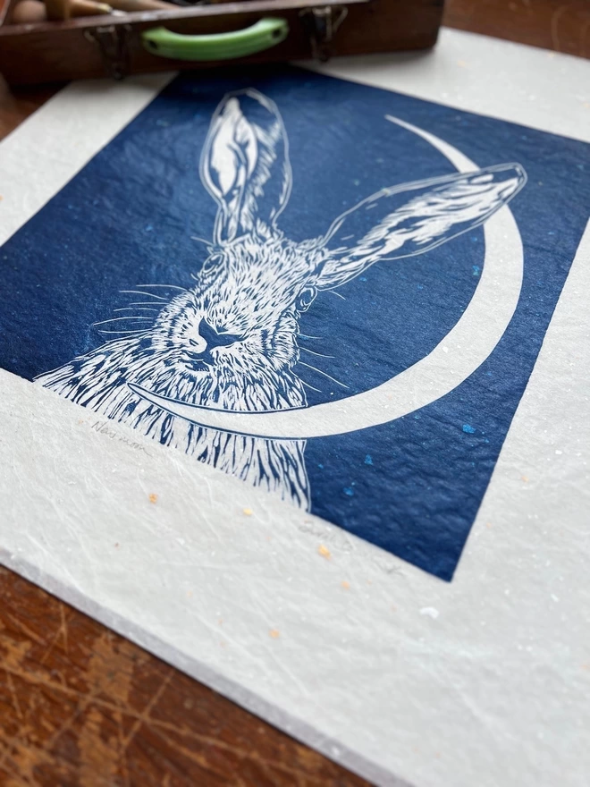 hare head and crescent moon linocut