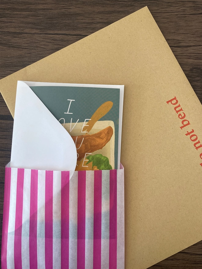 Chippy tea card packed with a white envelope inside a paper bag