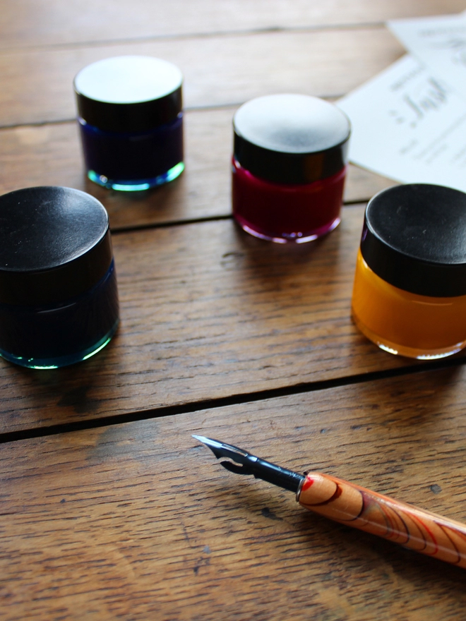 Meticulous Ink Colour Calligraphy Kit - Close up of 4 ink pots with nib and nib holder