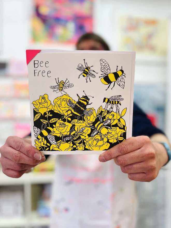 A riso printed charity card featuring a strong yellow & black Bee design & the words Bee Free