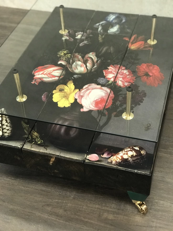 flower image on glass top coffee table