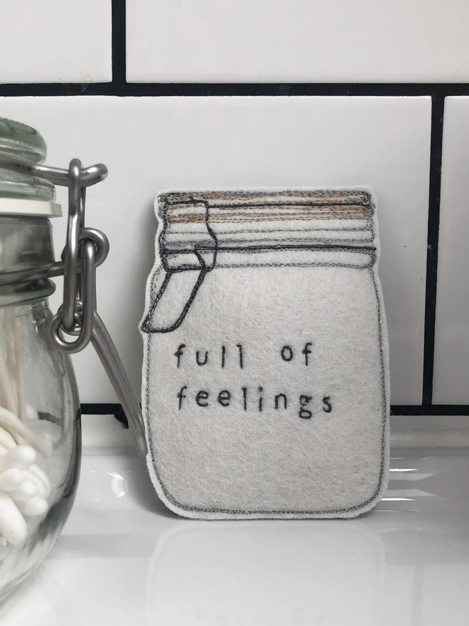 Jar Full of Feelings on bathroom sink with q-tips