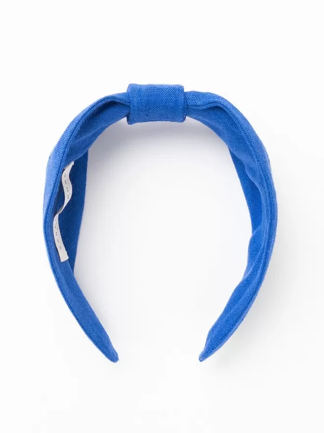 Vanessa Rose Ines Hairband in French Blue seen front on.
