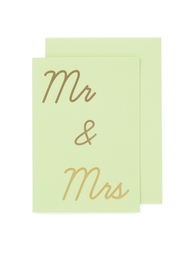 A mint green greeting card that says 'Mr & Mrs' in gold foil
