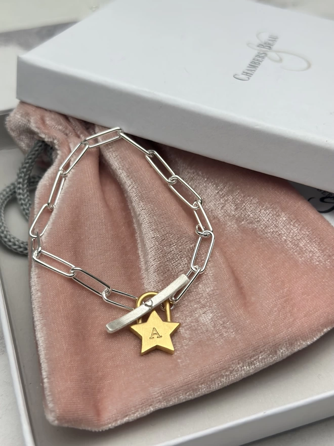 sterling silver paperclip bracelet with T bar fastener and personalised chunky gold star padlock charm. with gift box and pouch