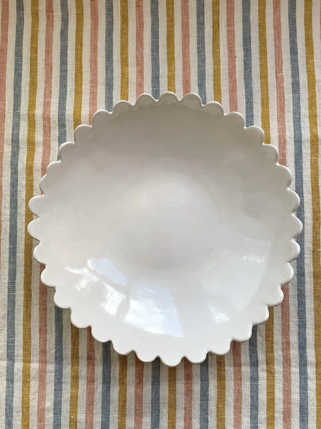white scalloped edge serving bowl, top view