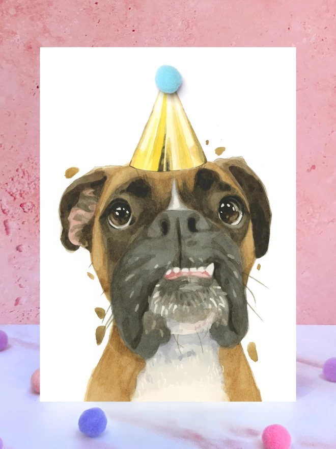 Boxer Dog Pompom Birthday Celebration Collection Card in front of a pink background and surrounded by pompoms