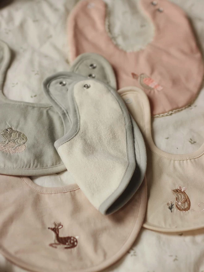 A set of cotton bibs with animal embroidery