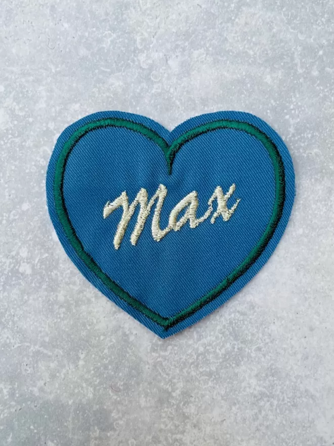 Custom heart patch in blue and green.