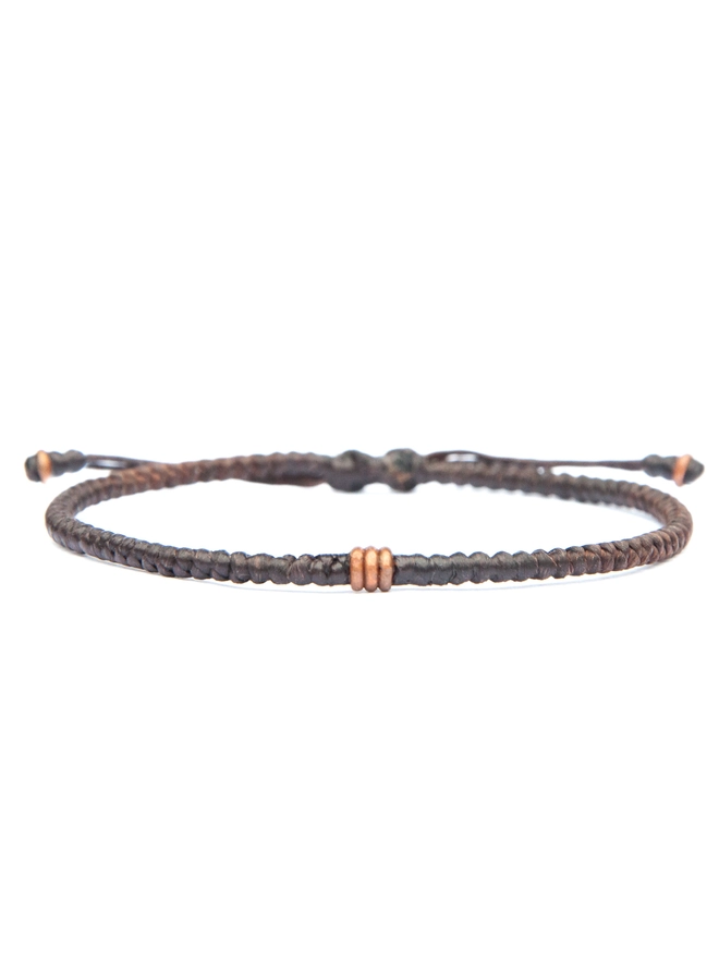 brown rope and copper bracelet