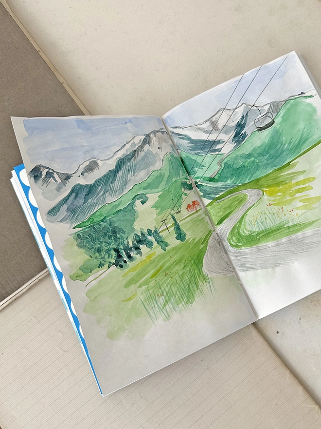 Inside pages of the travel journal showing painted picture
