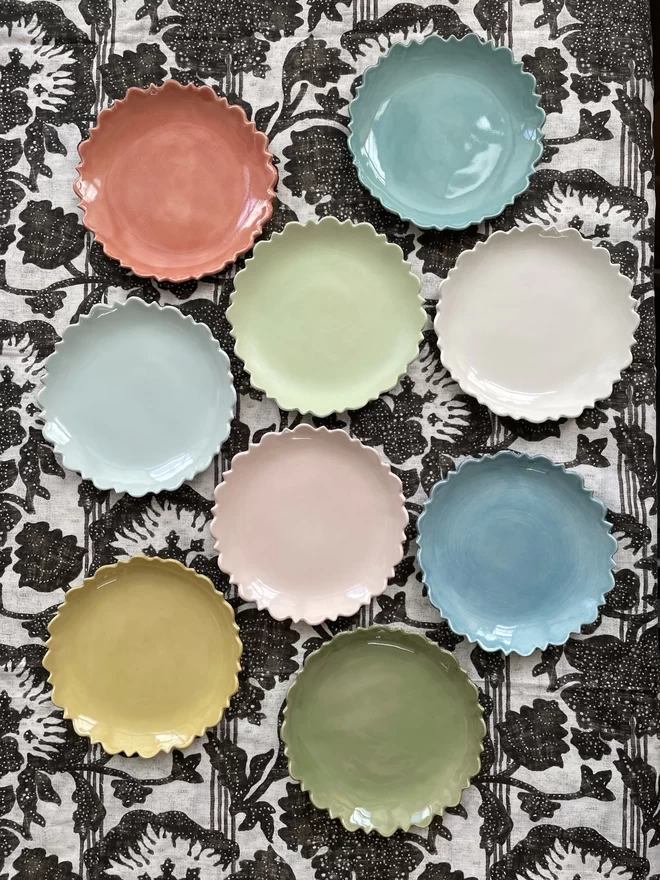 top shot of nine fiore edge serving bowls in pastel and bright colours 