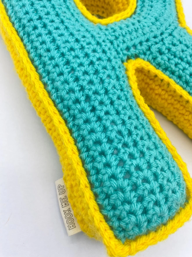 Crocheted Cushion shaped like an R in Teal and Sunshine Yellow