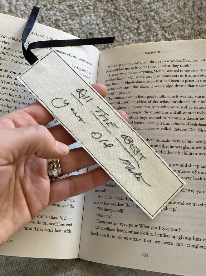 An embroidered bookmark featuring personalised handwriting