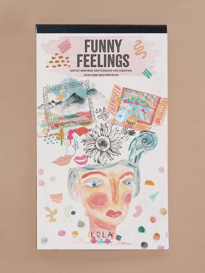 Funny Feelings Sketchbook for children, cover shows artist's rendition of walking down a path with lots of colourful emotions