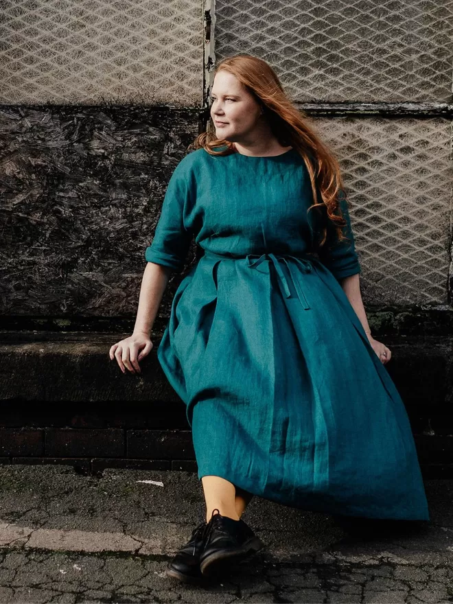 pleated linen dress in teal.
