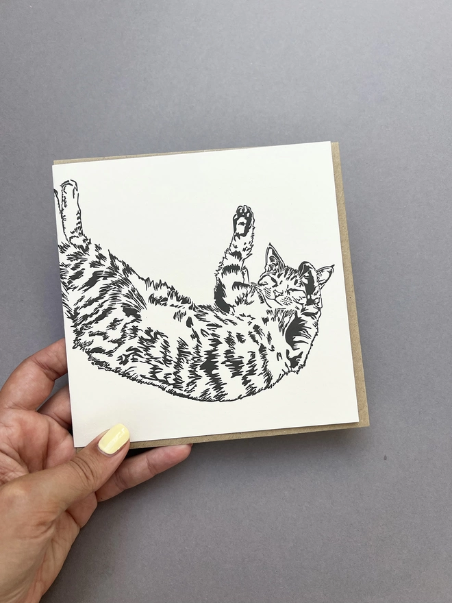 Front of the Time to stretch card showing a detailed tabby cat lying down and stretching