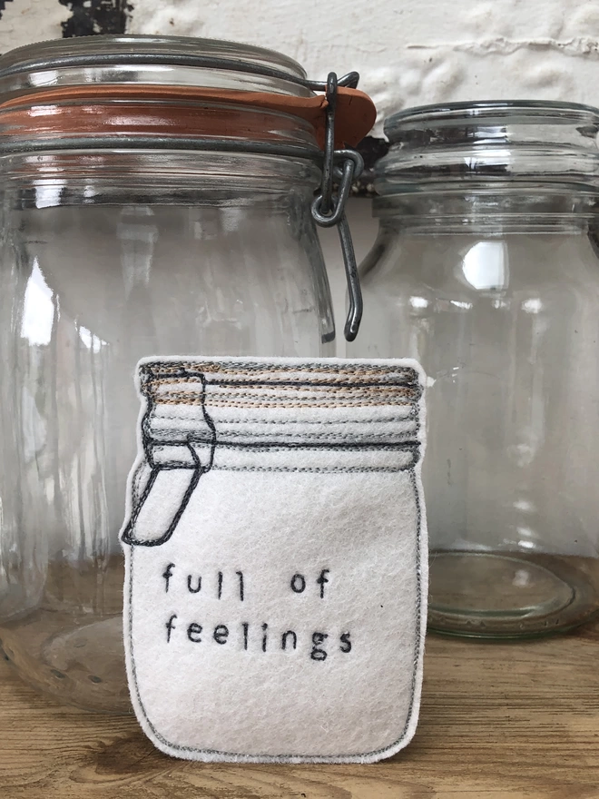 Jar Full of Feelings on shelf with glass jars