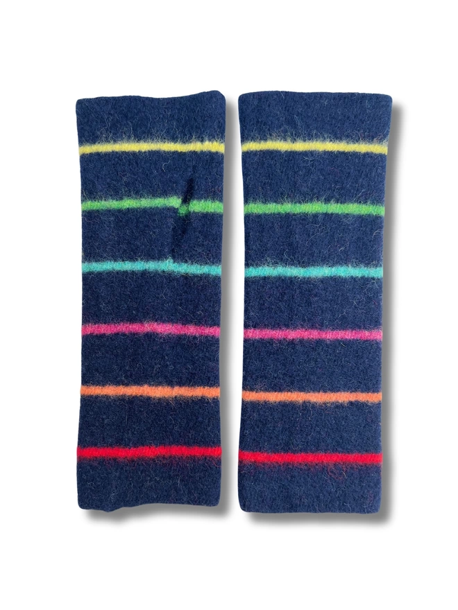 Knitted navy wristwarmers with multi coloured stripes laid flat next to each other
