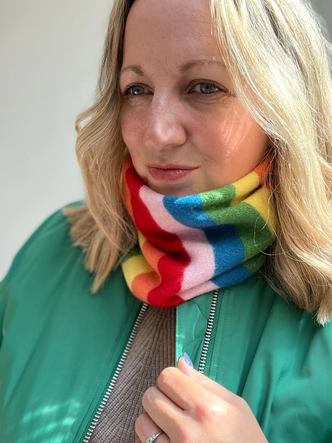 Rainbow knitted snood being worn