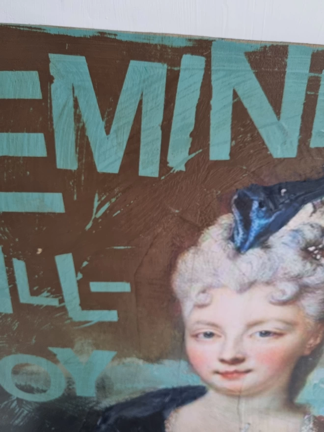Painted and decoupage art panel featuring an antique portrait of an aristocratic lady and duck egg blue wording that reads ‘feminist kill-joy’