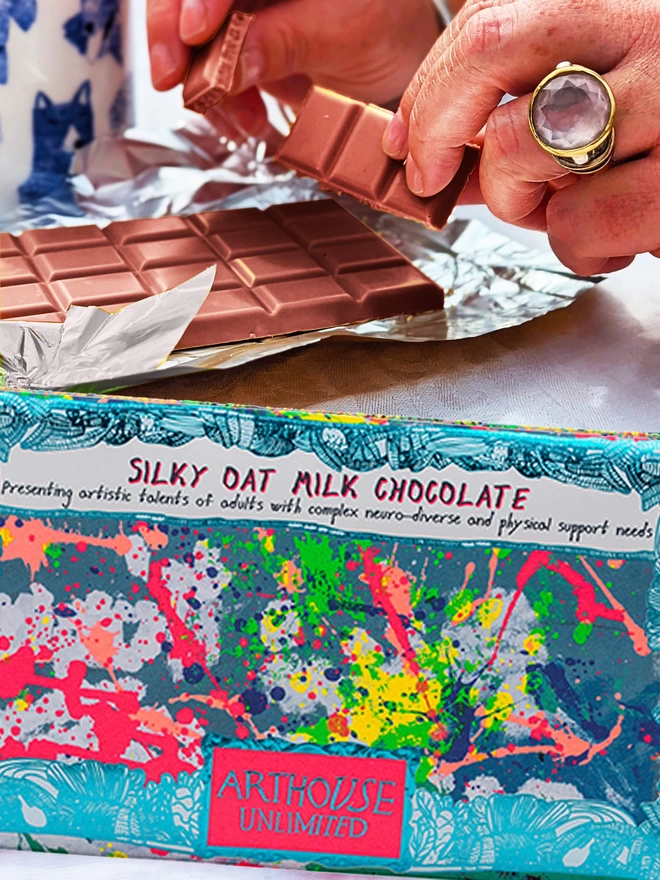 Spring oat milk charity chocolate bar wrapped in foild card with bright & colourful abstract design