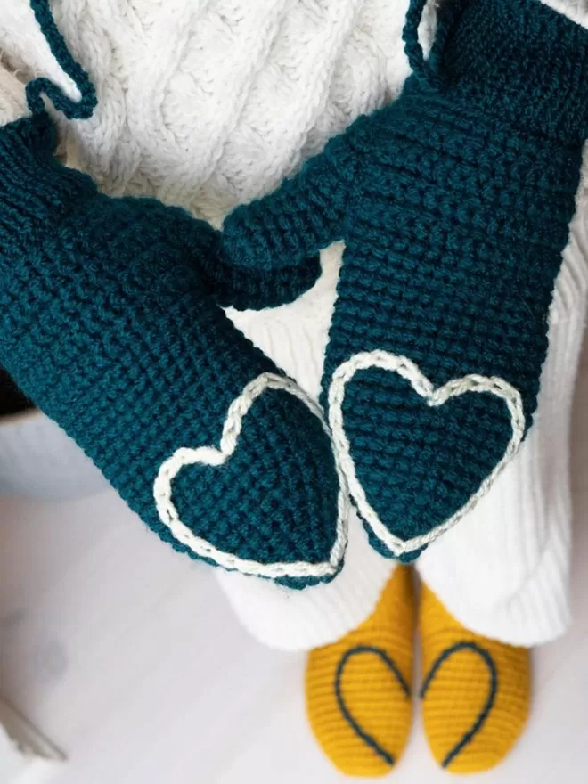 EKA Heart tipped mittens and socks in blue and white and yellow and blue.
