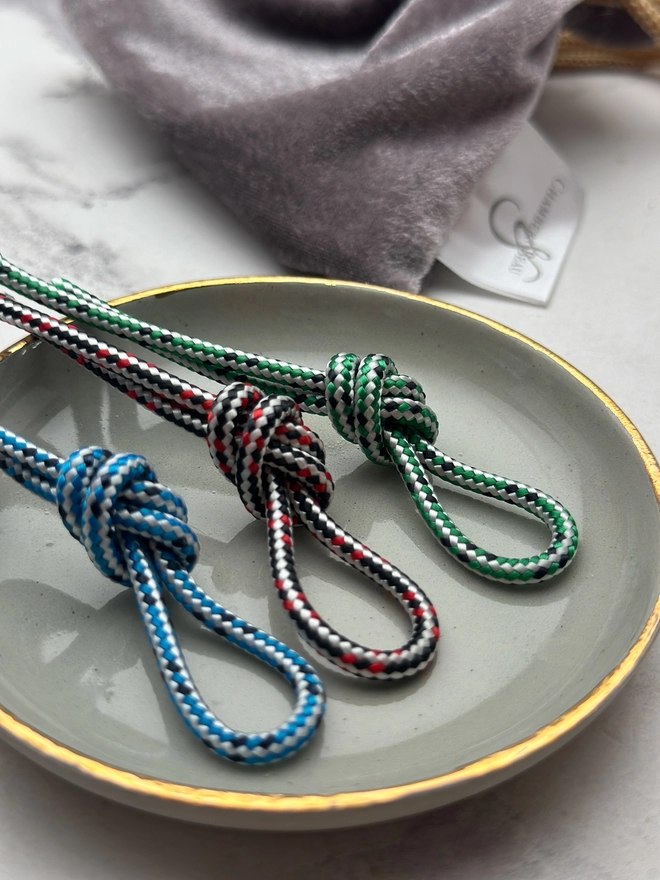 display showing the cord colour options for men's bead bracelet