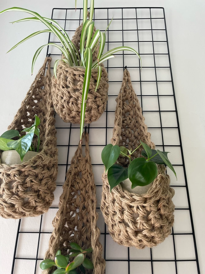 indoor large brown jute hanging wall planter, fabric wall mounted plant holder, handmade crochet plant basket, handmade sustainable crochet decor, rustic natural organic homeware accessorie, hanging plant holder 