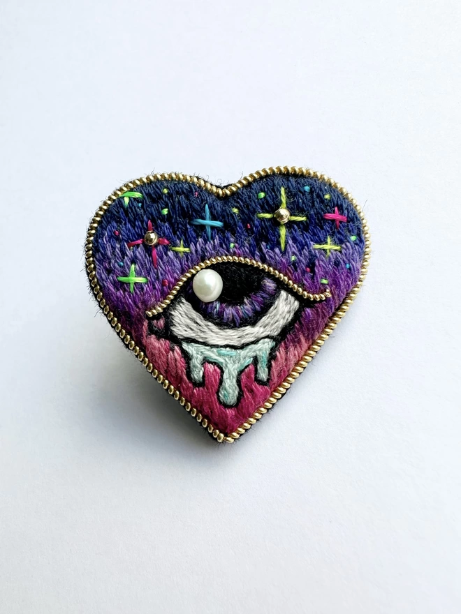 Heart shape brooch with tearful eye with pearl in the centre 