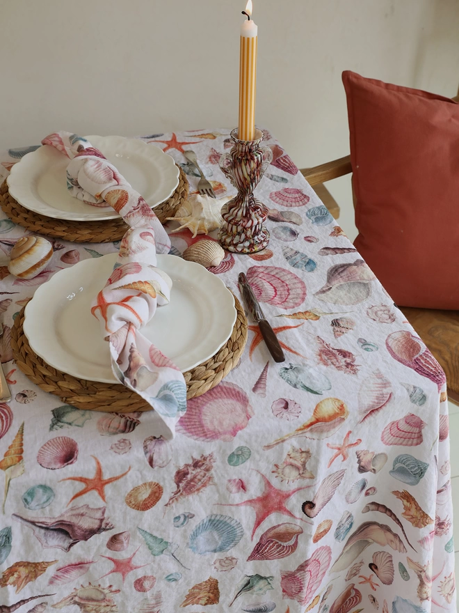Tablescape with linen printed with shells