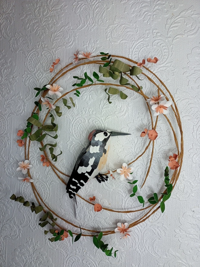 woodpecker wall art on a wreath of peach tree blossom