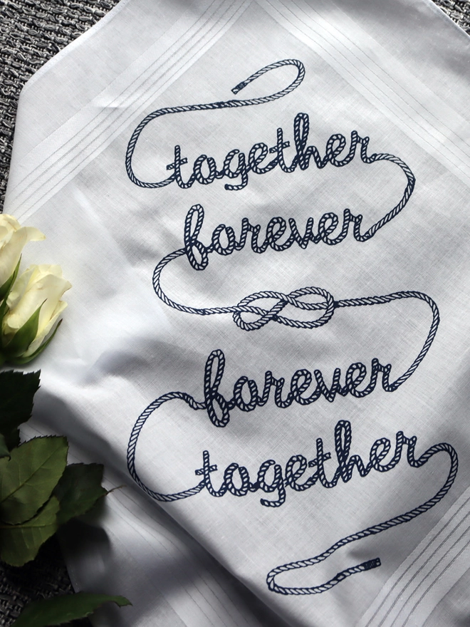 A Mr.PS Together Forever Hankie printed in midnight blue with some roses