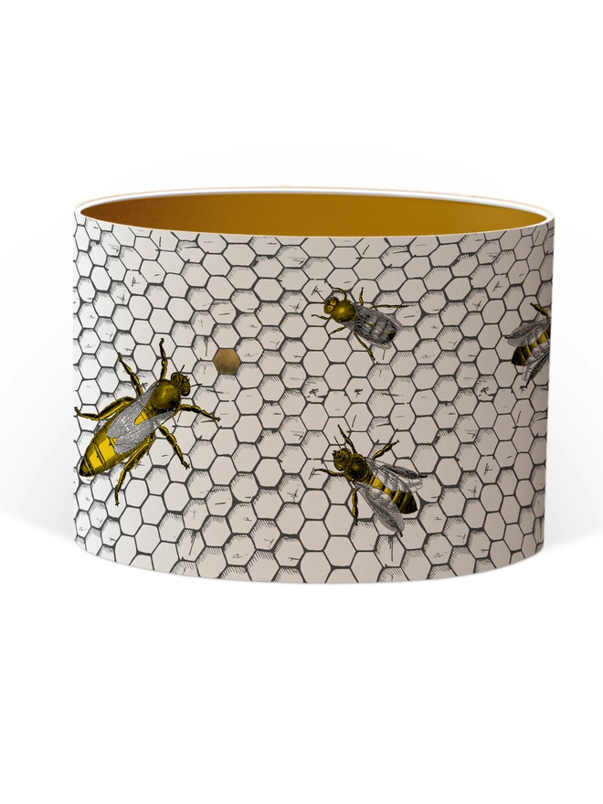 Drum Lampshade featuring honey bees on a honeycomb with a Gold inner on a white background