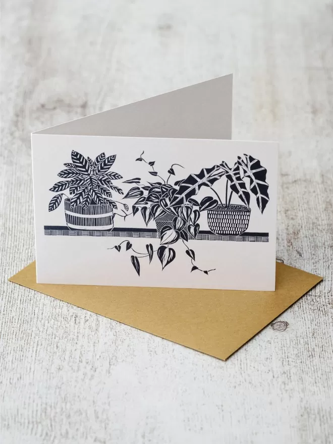 Greeting Card with an image of Three House Plants On A Shelf, taken from an original lino print
