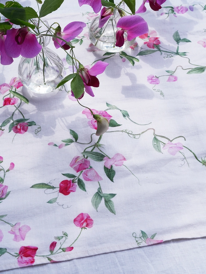 Close up of linen printed with sweet peas