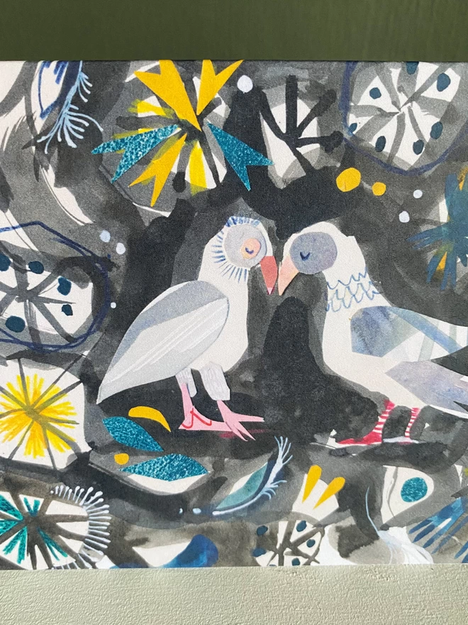 Black, grey, yellow and blie illustrated greetings card by Esther Kent shows two mouring doves surrounded by a pattern of stylised foliage.