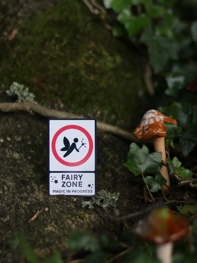 tiny fairy road sign in mushroom woodland