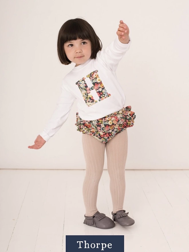 Childrens T-shirt in white with initial on the front in Thorpe Liberty print fabric