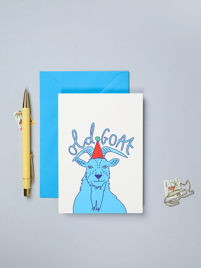 Colourful and bright birthday card featuring an old goat