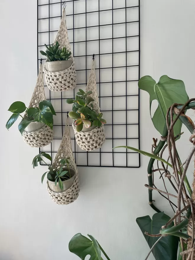 ndoor large ecru cotton hanging wall planter, cream fabric wall mounted plant holder, handmade crochet plant basket, handmade sustainable crochet decor, rustic natural organic homeware accessories, ivory hanging plant holder