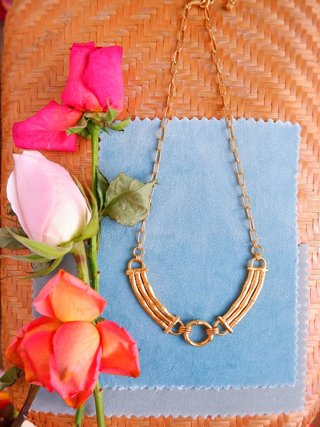 gold vermeil Bamboo bar sectional necklace with ring, on chain. Blue velvet & roses