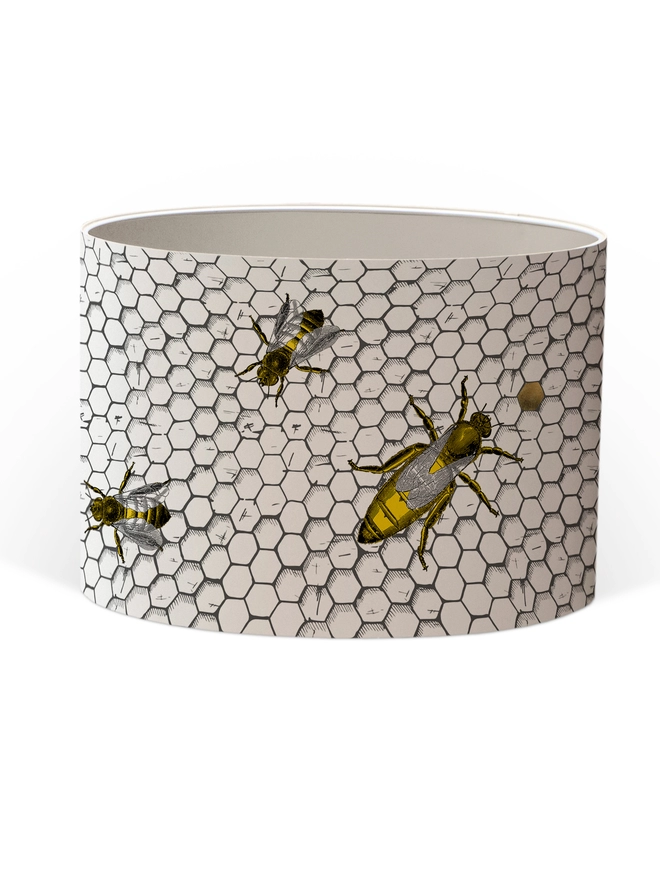 Drum Lampshade featuring honey bees on a honeycomb with a white inner on a white background