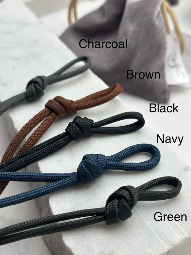 display showing the cord colour options for men's bracelets