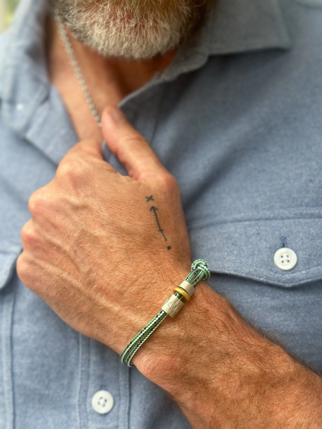 model wears men's personalised sterling silver bead friendship bracelet